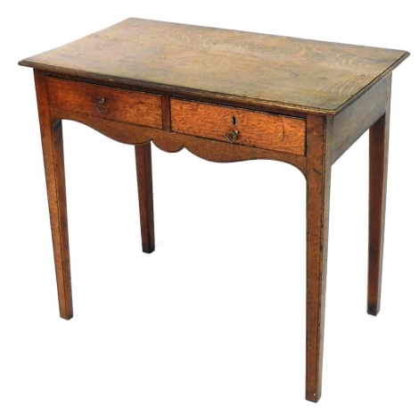 A 19thC oak side table, the rectangular top with a moulded edge above two frieze drawers, on square tapering legs, 73cm high, 84cm wide, 47cm deep.