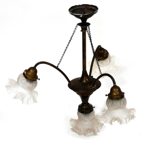 A brass ceiling light, with four frosted glass shades, 56cm drop.