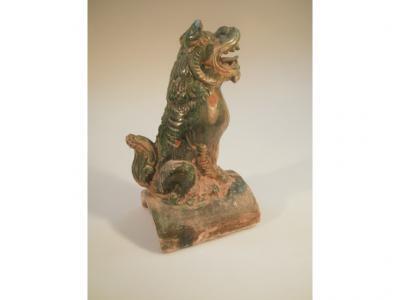 A Ming dynasty roof tile guardian in the form of a seated mythical creature
