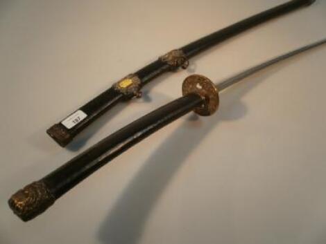 A 18thC/19thC Japanese Katana with brass Tsuba and mounts to the handle