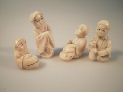 Four early 20thC Japanese ivory netsuke figures