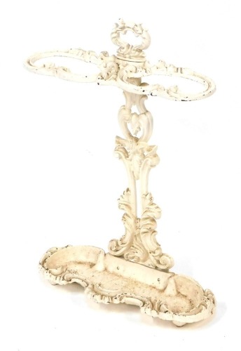 A Coalbrookedale style cast iron umbrella stand, in white finish with rococo detailing, 63cm high, 45cm wide, 15cm deep.