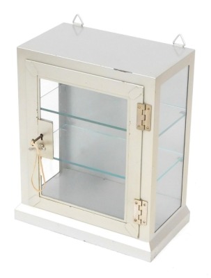 A steel glass display cabinet, with folded cornice top and single shelf, with key, 46cm high, 38cm wide, 21cm deep.