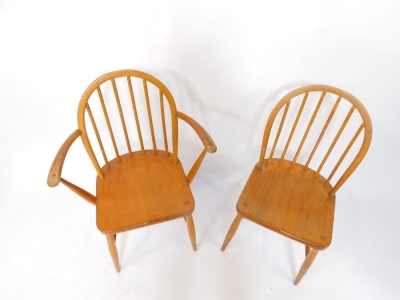 Two Ercol pine stick back kitchen chairs, to include one carver. - 2