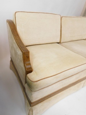 An Art Deco pollard oak framed three seater sofa, with cream upholstery, possibly American, 80cm high, 212cm wide, 80cm deep. The upholstery in this lot does not comply with the 1988 (Fire & Fire Furnishing) Regulations, unless sold to a known exporter or - 3