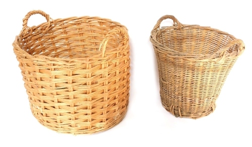 Two wicker log baskets, 67cm and 52cm diameter.