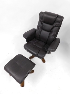 A Julian Bowen dark brown leatherette armchair and matching footstool. (2) - 2