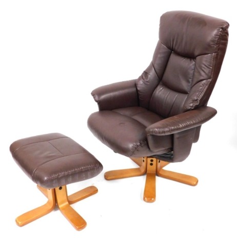 A Julian Bowen light brown leatherette armchair and matching footstool. (2)