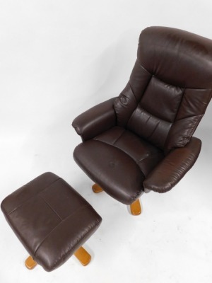 A Julian Bowen light brown leatherette armchair and matching footstool. (2) - 2