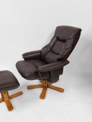 A Julian Bowen light brown leatherette armchair and matching footstool. (2) - 3