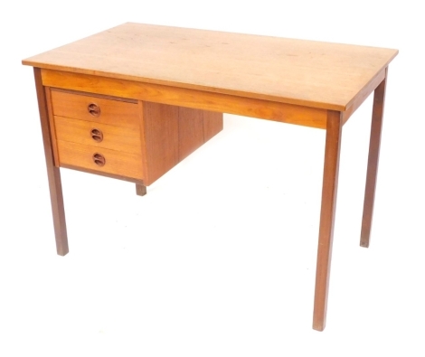 A 1960's/1970's teak desk, with three drawer arrangement, on tapered legs, 72cm high, 103cm wide, 60cm deep.