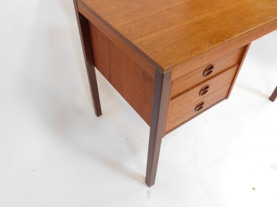 A 1960's/1970's teak desk, with three drawer arrangement, on tapered legs, 72cm high, 103cm wide, 60cm deep. - 3