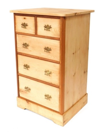 A stripped pine chest of drawers, with two short and three long drawers, with brass scroll handles, on bracket feet, 110cm high, 87cm wide, 57cm deep.