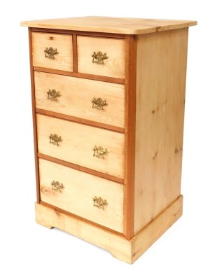 A stripped pine chest of drawers, with two short and three long drawers, with brass scroll handles, on bracket feet, 110cm high, 87cm wide, 57cm deep.