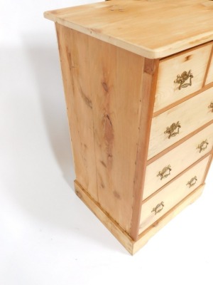 A stripped pine chest of drawers, with two short and three long drawers, with brass scroll handles, on bracket feet, 110cm high, 87cm wide, 57cm deep. - 3