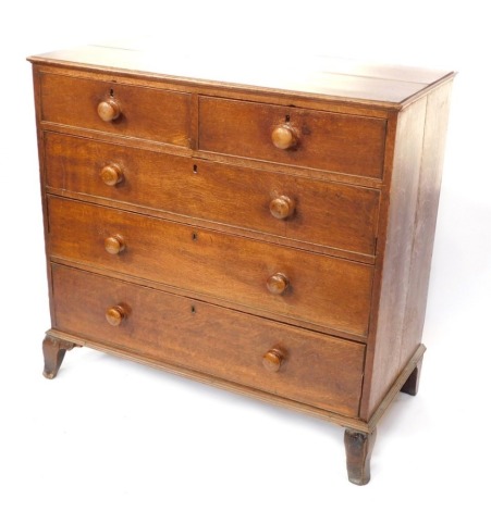 A George III oak chest of two short over three long graduated drawers, raised on outswept feet, 103cm high, 109cm wide, 53.5cm deep.