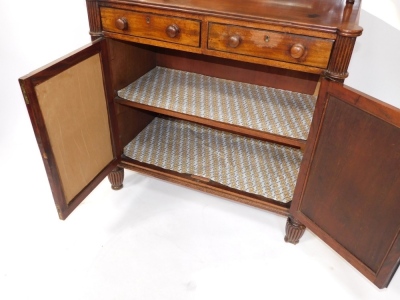 A late Regency mahogany chiffonier, the pendimented back with a single shelf raised on turned columns, over two drawers above a pair of panelled doors, raised on fluted columns and feet, 123cm high, 91cm wide, 48cm deep. - 3