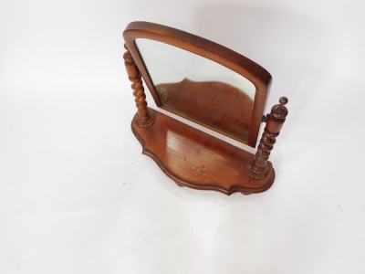 A Victorian mahogany swing framed toilet mirror, raised on turned and spiral twist columns, over a serpentine base, raised on three leaf carved feet, 66cm high, 64cm wide. - 2