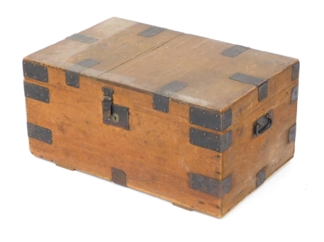 A Victorian pine and iron bound trunk, by G Drinkwater, late R Wagstaff, 26 Eastgate Street, Gloucester, with paper lined interior, bears maker's label, 53cm high, 68cm wide. 44cm deep.