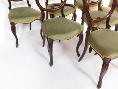 A set of six Victorian rosewood balloon back dining chairs, the overstuffed seats upholstered in green draylon, raised on cabriole legs. - 3