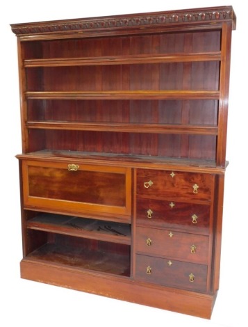 A Victorian mahogany office library bookcase, the carved outswept pediment over an open case of two adjustable shelves, the lower section with a drop front opening to reveal eight recesses, above a further bookcase flanked to the right by four drawers, ra