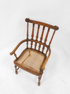 A Victorian oak and elm country armchair, with a cane seat, raised on turned legs, united by a turned H framed stretcher. - 2