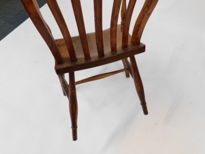 A 19thC beech and elm lath back kitchen chair, with solid saddle seat, raised on turned legs united by a H framed stretcher. - 4