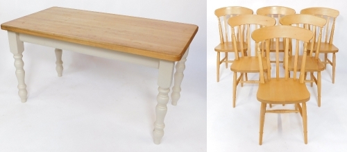 A pine kitchen table, raised on cream painted turned legs, 58cm high, 151cm wide, 81cm deep, together with six beech kitchen chairs.