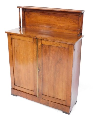 A Victorian rosewood chiffonier, the galleried with two doors enclosing two shelves, raised on a plinth base, on later block feet, 122cm high, 92cm wide, 55cm deep.