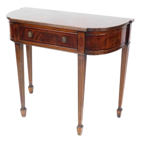 A Georgian style mahogany side table, with line inlay, having a single frieze drawer, raised on chanelled tapering square legs on spade feet, 78cm high, 91.5cm wide, 41.5cm deep.