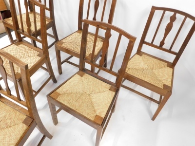 A set of six George III oak and rush seated dining chairs. - 2