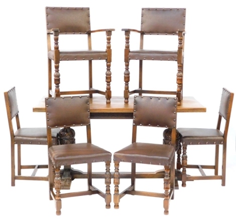 A Carolean style oak refectory dining table, raised on cup and cover supports united by a H frame block base, 78cm high, 152cm wide, 75.5cm deep, together with six matching dining chairs with leatherette seats, comprising a pair of carvers and four single
