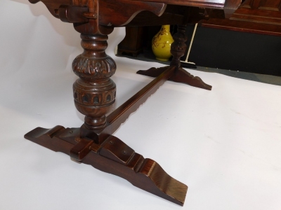 An oak refectory dining table, raised on carved cup and covered supports, and block feet united by a stretcher, 50cm high, 183cm wide, 91cm deep. - 3