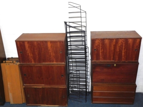 A group of shelving in the Ladderax style, comprising four two door cupboards, 76cm wide, 42cm high, 36cm deep, two fall flap cupboard, 42cm high, 76cm wide, seven metal supports and seventeen various sized and wood shelves.