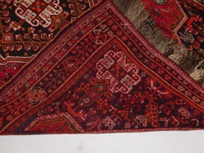 A Persian Shiraz type carpet, with a central medallion on a red ground decorated with flowers, leaves, birds, etc, within multiple borders, 160cm x 266cm. - 5