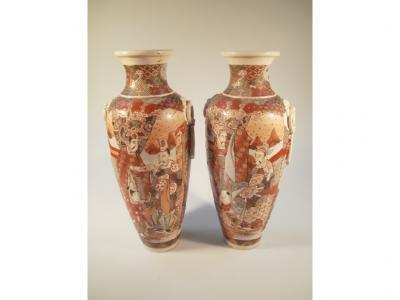A pair of Japanese Satsuma baluster vases decorated with figures of the court