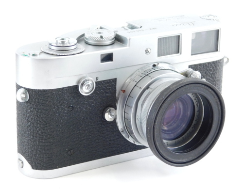 A Leica Leitz Wetzlar camera, M2-945 600, with Elmar f=5cm 1:2.8 lens 1634791, with outer case, 9cm high.