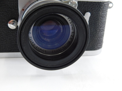 A Leica Leitz Wetzlar camera, M2-945 600, with Elmar f=5cm 1:2.8 lens 1634791, with outer case, 9cm high. - 4