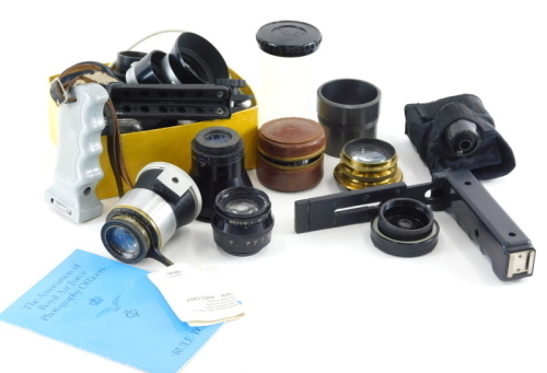 Various Leica and other camera lenses and accessories, to include a Jupiter-8 2/50 lens, 4cm high, a Carl Zeiss Tessar lens 4,5 f=1.2cm lens, lens caps, film cases and other item. (a quantity)