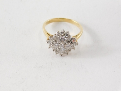 An 18ct gold and diamond ladies floral cluster ring, set with twenty one diamonds, size M. - 2