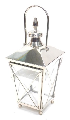 A chrome plated lantern, of tapering form with bun feet, unused, 73cm high.