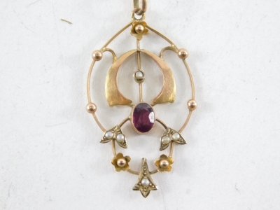 An Edwardian pendant and chain, the oval pendant set with garnet and seed pearls, yellow metal stamped 9c, 4cm high, on a fine link neck chain, yellow metal, unmarked, 40cm long, 3.9g all in. - 2