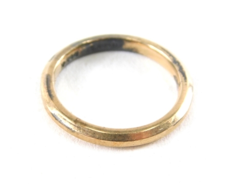 A wedding band, of plain design, yellow and white metal stamped 9ct gold on silver, ring size K, 2.2g all in.