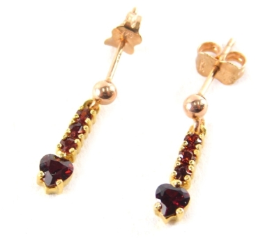 A pair of 9ct gold garnet drop earrings, with love heart cut garnet cut drops, on rose gold single pin back with butterfly backs, 1½cm high, 1.8g all in, boxed.