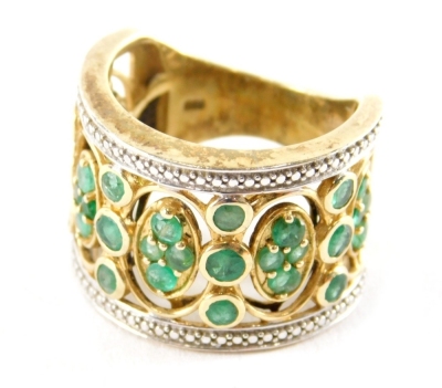 A Middle Eastern inspired dress ring, set with green and white paste stones, in silver and silvered gilt white metal, stamped 925, ring size S½, 9.8g all in.