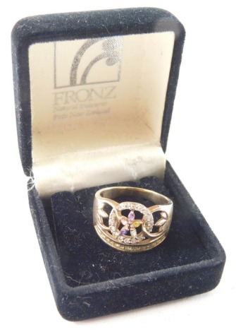 A 9ct gold dress ring, of elaborate design with central loop with cluster multicoloured stone set pendant, and baguette set coloured stone base, ring size Q½, 5.8g all in.