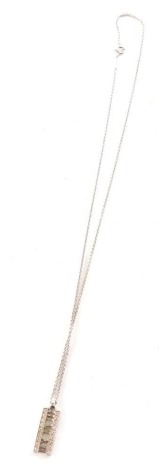 An Atlas Tiffany pendant, set with white stones and Roman numerals, 2cm long, attached to a slender link chain, marked Atlas 2003, Tiffany & Co, 750, Italy, 7g.