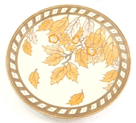 A 1930's Charlotte Rhead Crown Ducal charger, decorated with autumnal leaves, 32cm diameter.