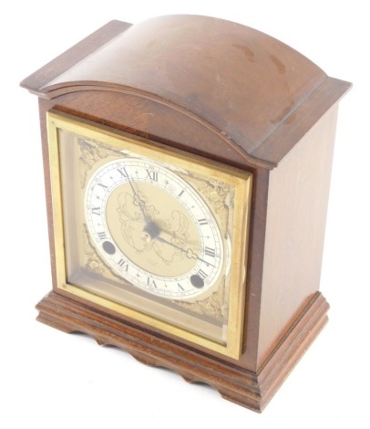 Elliott London. An early 20thC mantel clock, with 10cm diameter Roman numeric and Arabic chapter ring, raised ring spandrels, in a domed case with eight day movement chiming on the hour and half hours, 21cm high.