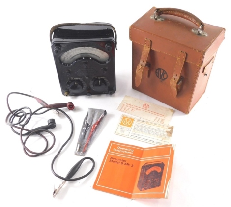 A Universal Avometer, in metal case, with leather strap and front wire, 20cm high, in leather case with other accessories. (a quantity)